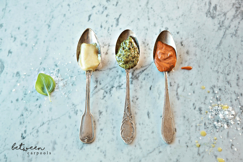 3 silver spoons, each with a pasta sauce: Penne a la Vodka, Pesto Cream Pasta Sauce and Alfredo Sauce