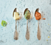 3 silver spoons, each with a pasta sauce: Penne a la Vodka, Pesto Cream Pasta Sauce and Alfredo Sauce