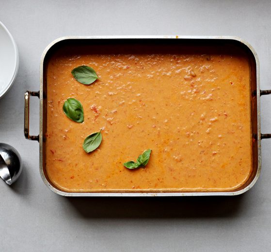 Dairy, Creamy Roasted Tomato Soup in a Nonstick Deep Roasting Pan. Bowls, spoons and a ladle nearby.