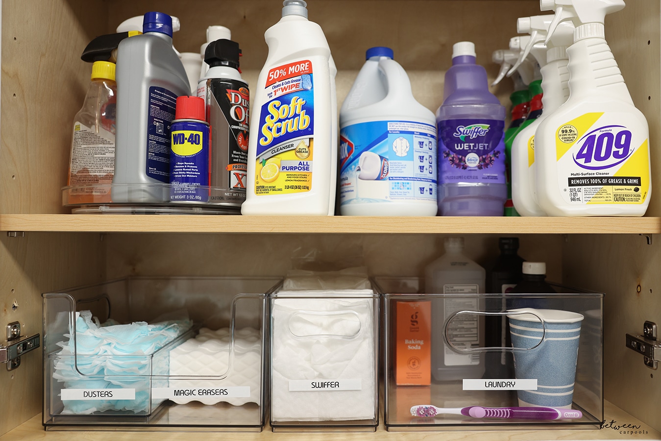 Laundry room upper cabinet with supplies and Home Edit bins