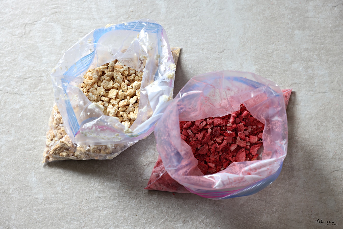 dried strawberries and vanilla sandwich cookies smashed in Ziploc bags