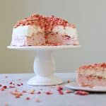 Strawberry Crunch Ice Cream on a cake plate, topped with the rest of the crumbs.