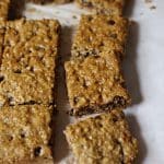 Closeup of Healthy Chewy Muffin Squares. Baked muffin batter on parchment paper, cut into squares.