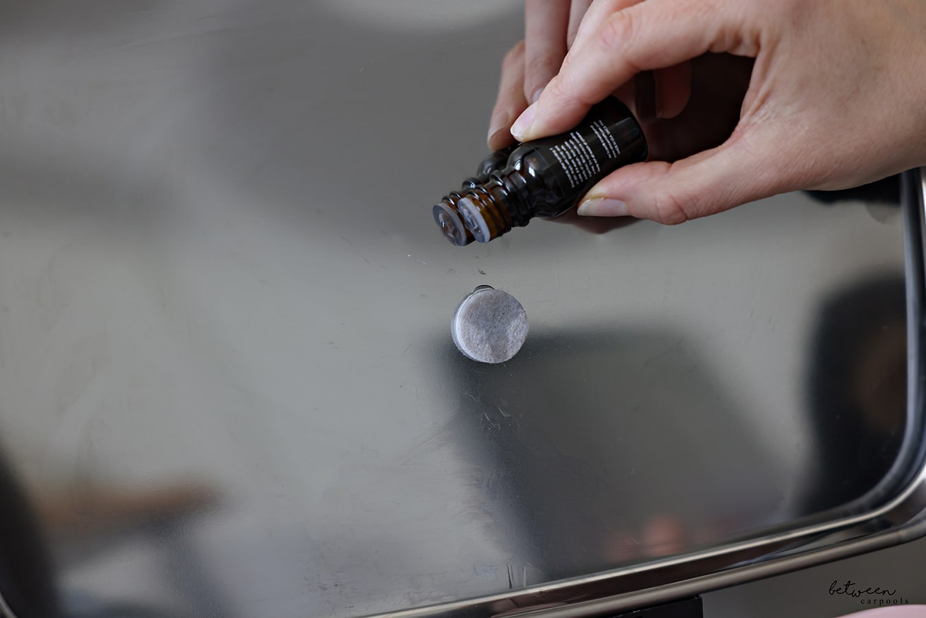Dropping some drops of scented oil on a Felt Furniture Pad.
