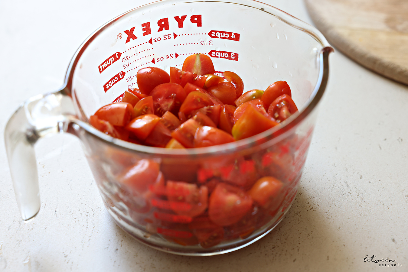 3 cups quartered grape tomatoes in a Pyrex glass 4 cups measuring cup.