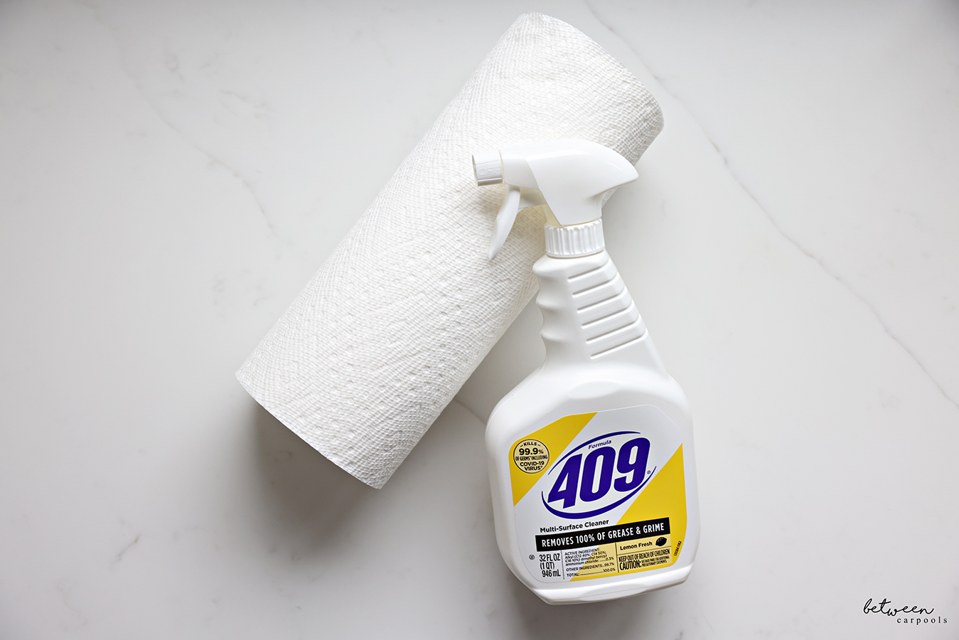 Formula 409 Multi-Surface Cleaner and a roll of paper towels on a Quartz countertop.