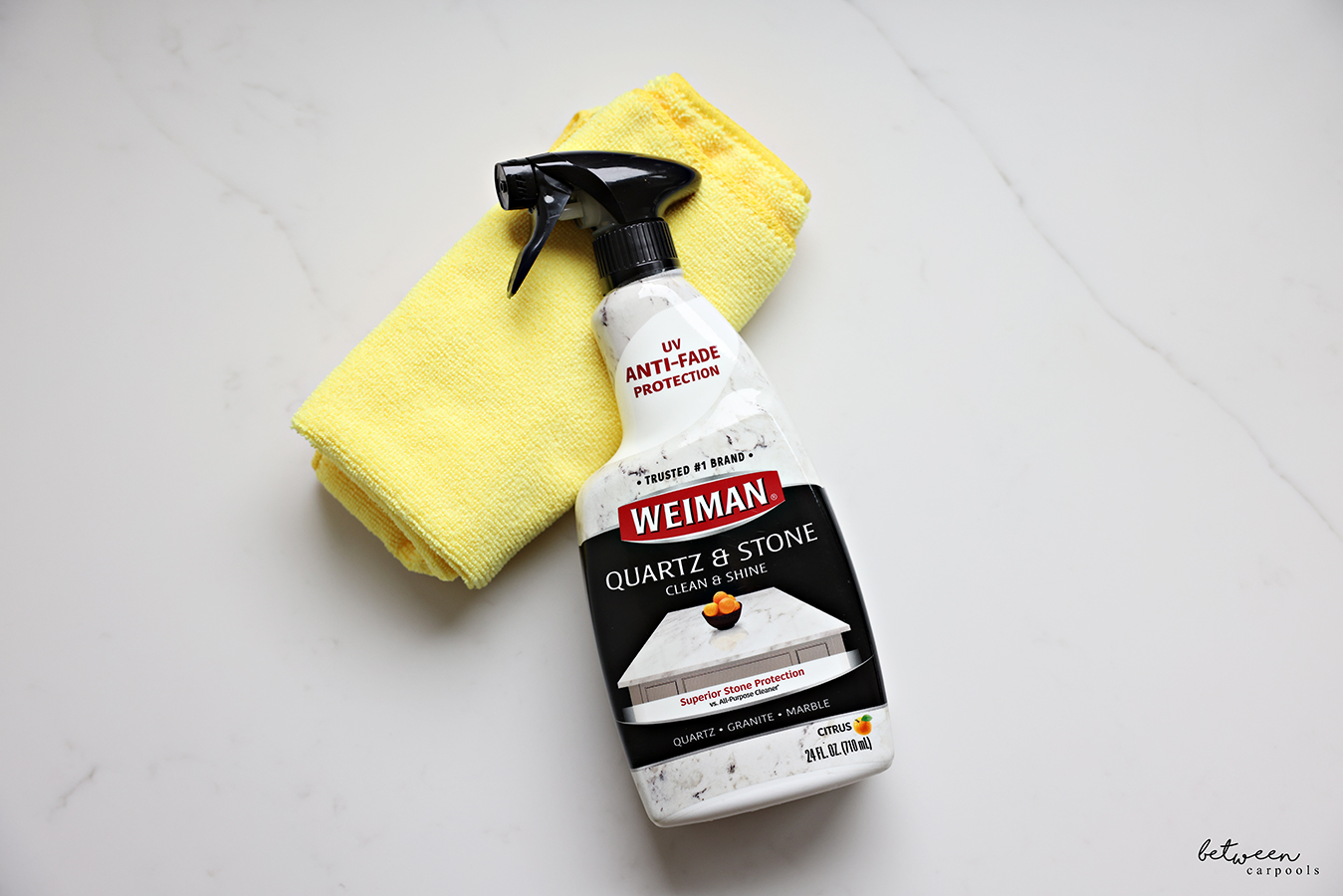 Formula 409 Multi-Surface Cleaner and a roll of paper towels on a Quartz countertop.