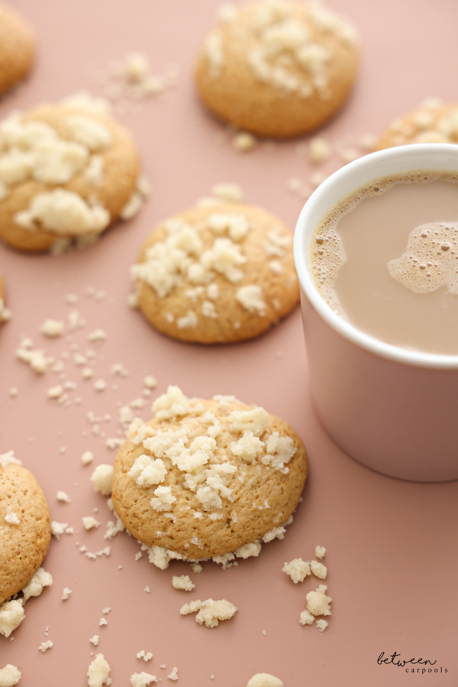 Honey Muffin Top Cookies on a pink surface with a coffee nearby.
