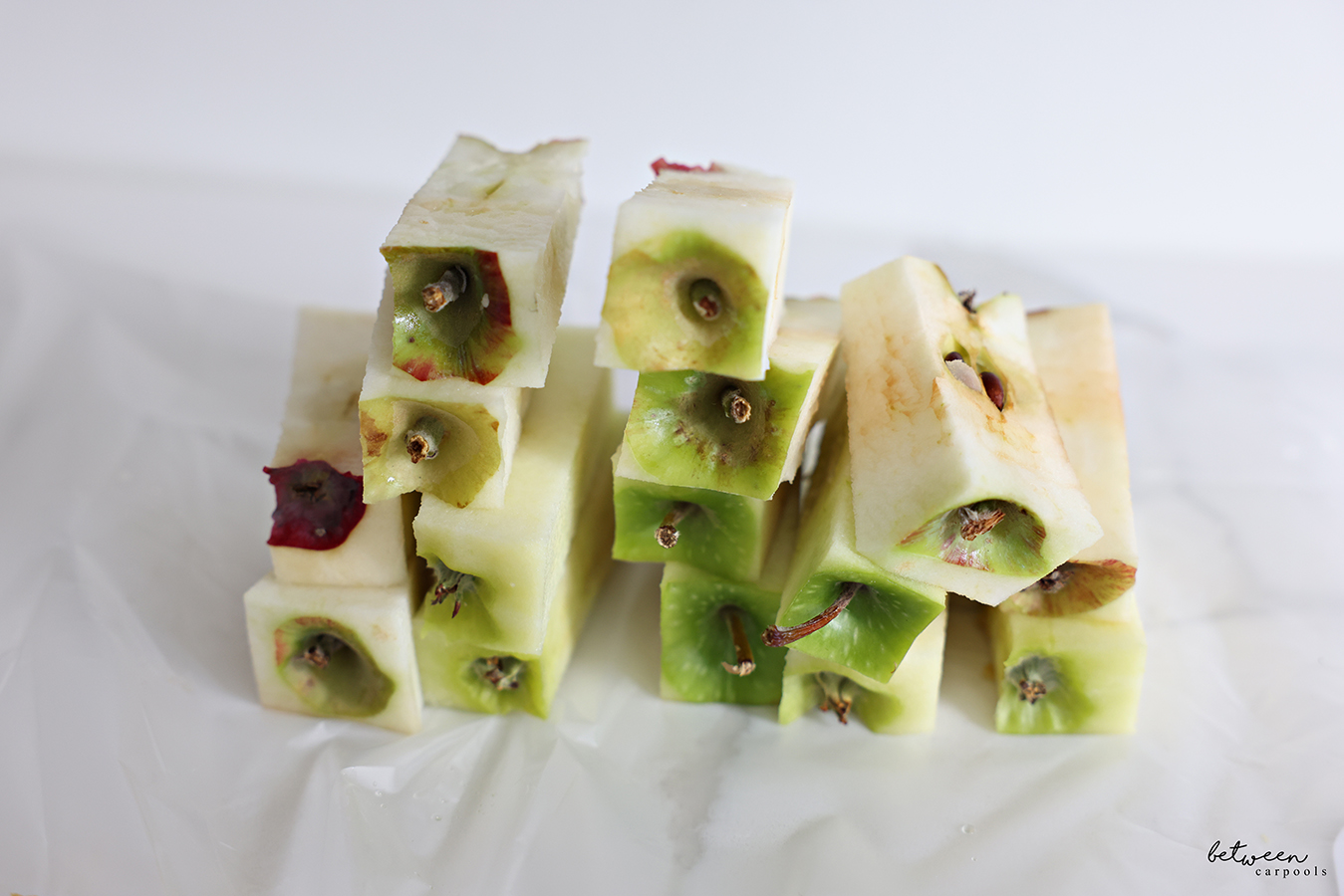 Cute pile of perfectly sliced apple cores.