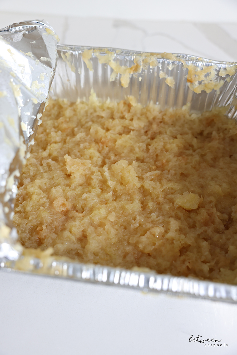 Deep 9x13 pan of baked applesauce.